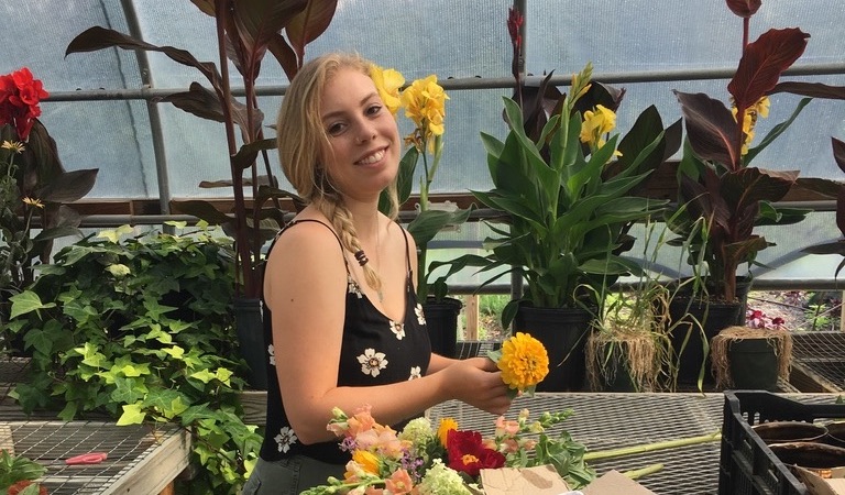 Eliza Forrest in greenhouse